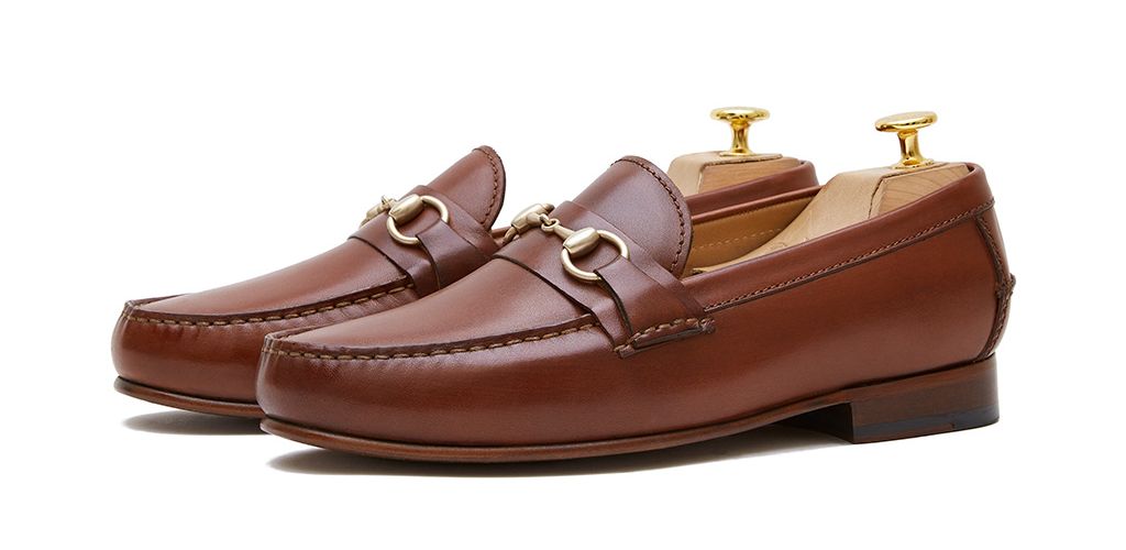 Loafers slip on buckle. Comfortable brown leather moccasins for summer
